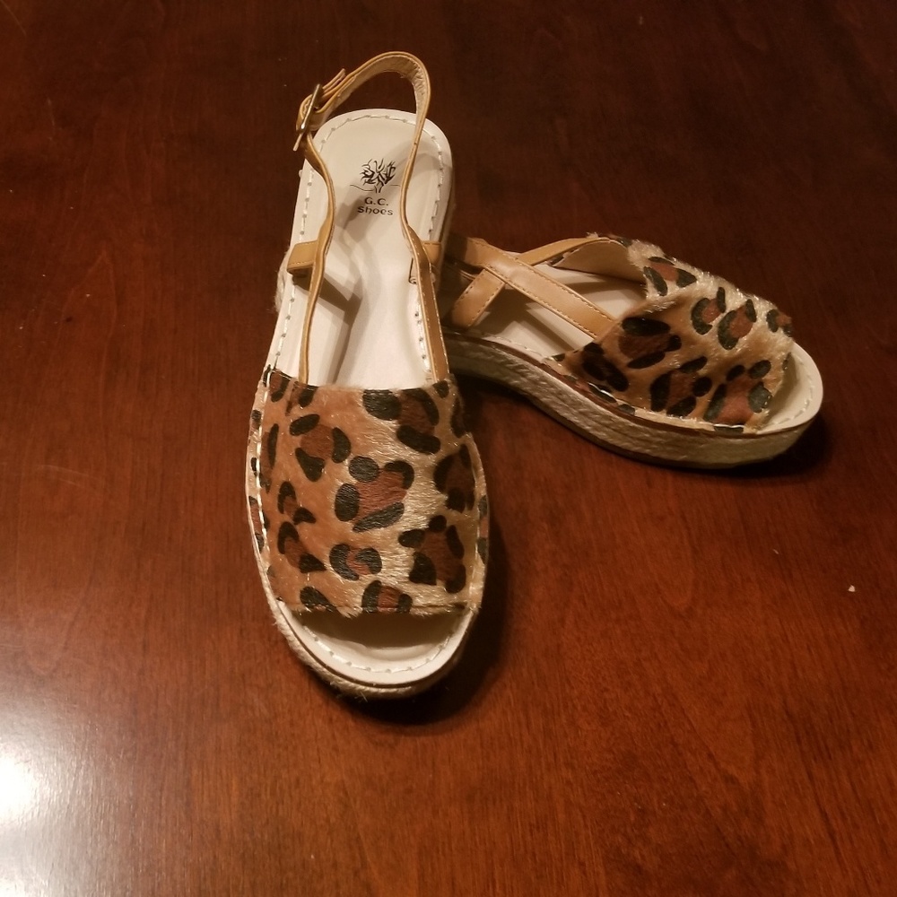 1 left Sz 10 left  Animal print faux fur sandals